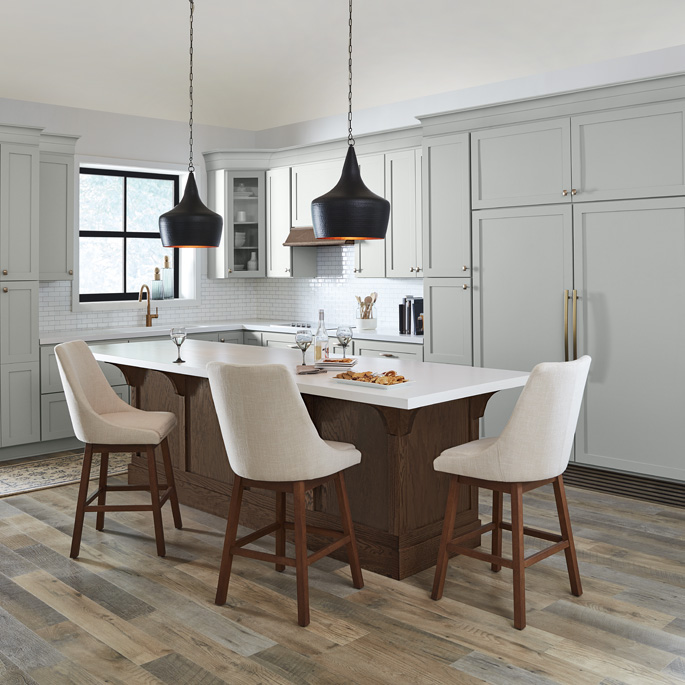 A gray and white kitchen painted with Behr Dynasty Interior paint
