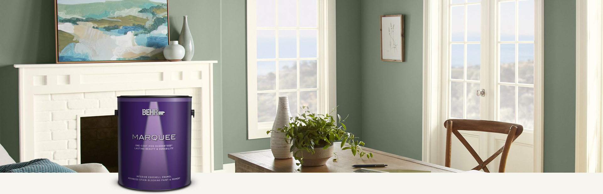 Living room painted in Marquee interior paint with a smiling couple in the background